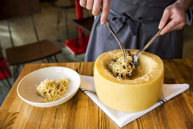 Florence: Flambé Cheese Wheel Truffle Pasta Class & Tiramisù - The pasta is cooked for everyone