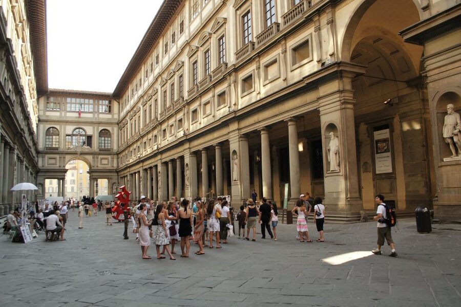 Florence: Full-Day Tour with Uffizi and Accademia Gallery - Walking across Florence toward the Duomo