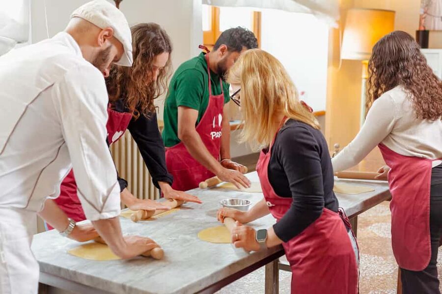 Florence: Pasta Class with Wine, Limoncello and Dessert - Mixing eggs and flour by hand