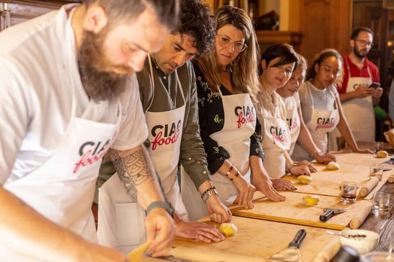 Florence: Pasta & Tiramisu Class with Unlimited Wine - Sitting down to eat what you made
