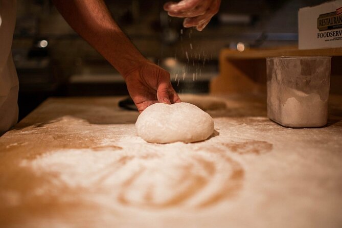 Pizza Making Private Class with Wine Tasting - Shaping the pizza and managing the sauce