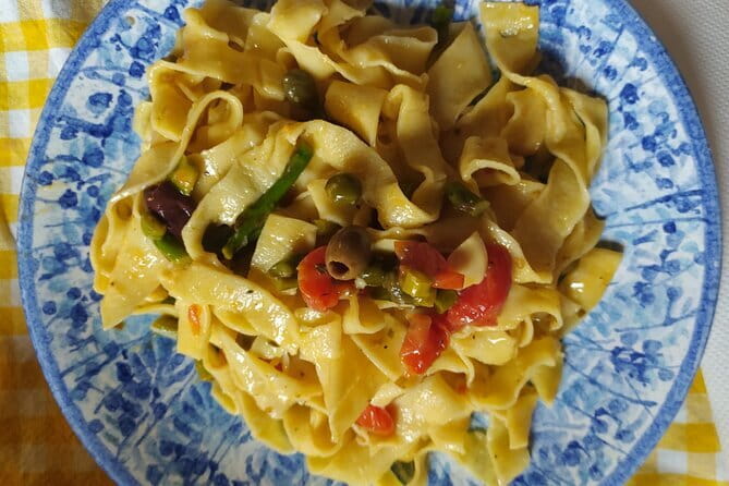 Private and authentic cooking class experience with family - Rolling, cutting, and filling fresh pasta
