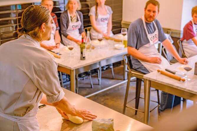 The Italian Way: Pizza and Gelato Class with Unlimited Wine - Shaping your pizza and choosing the toppings